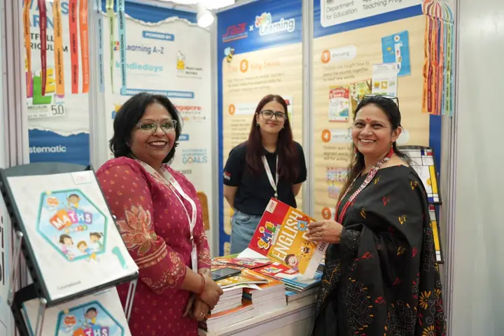 KIS staff at an exhibition stall of children’s books and learning material at the event