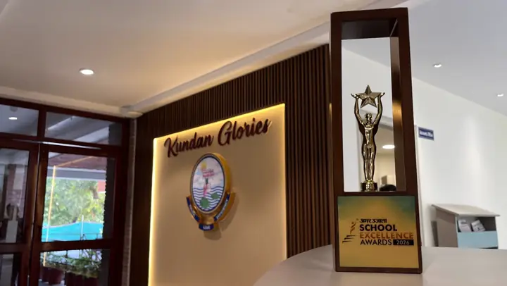 The School Excellence Awards 2026 trophy on display beside the Kundan Glories wall