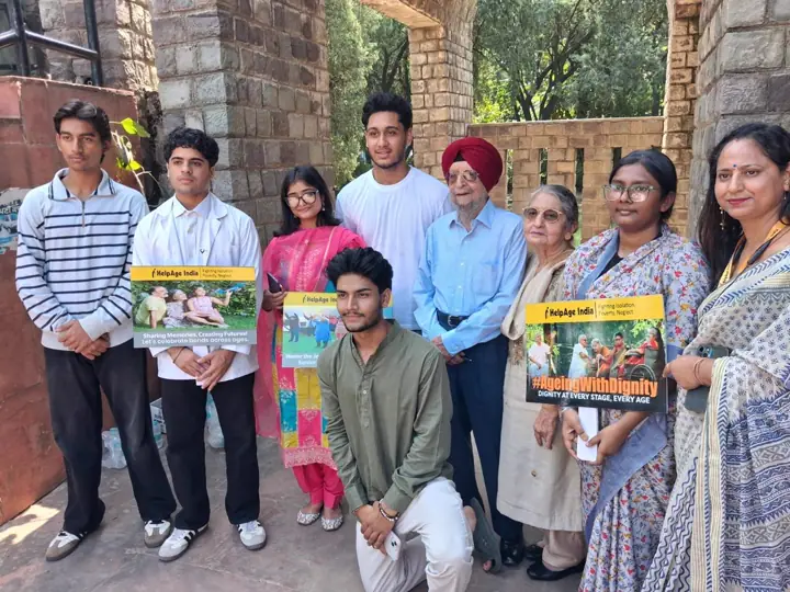 Students, teachers and elders standing together and holding placards
