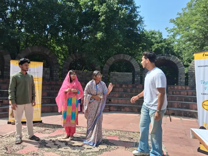 Students performing a short play in front of the brick arches