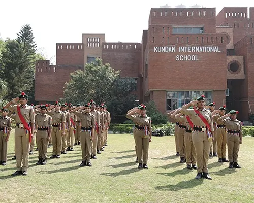 NCC cadets saluting on the school ground